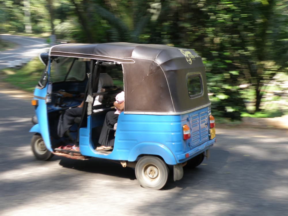A tuk-tuk on a Sri Lankan road — the easiest way to get around Habarana
